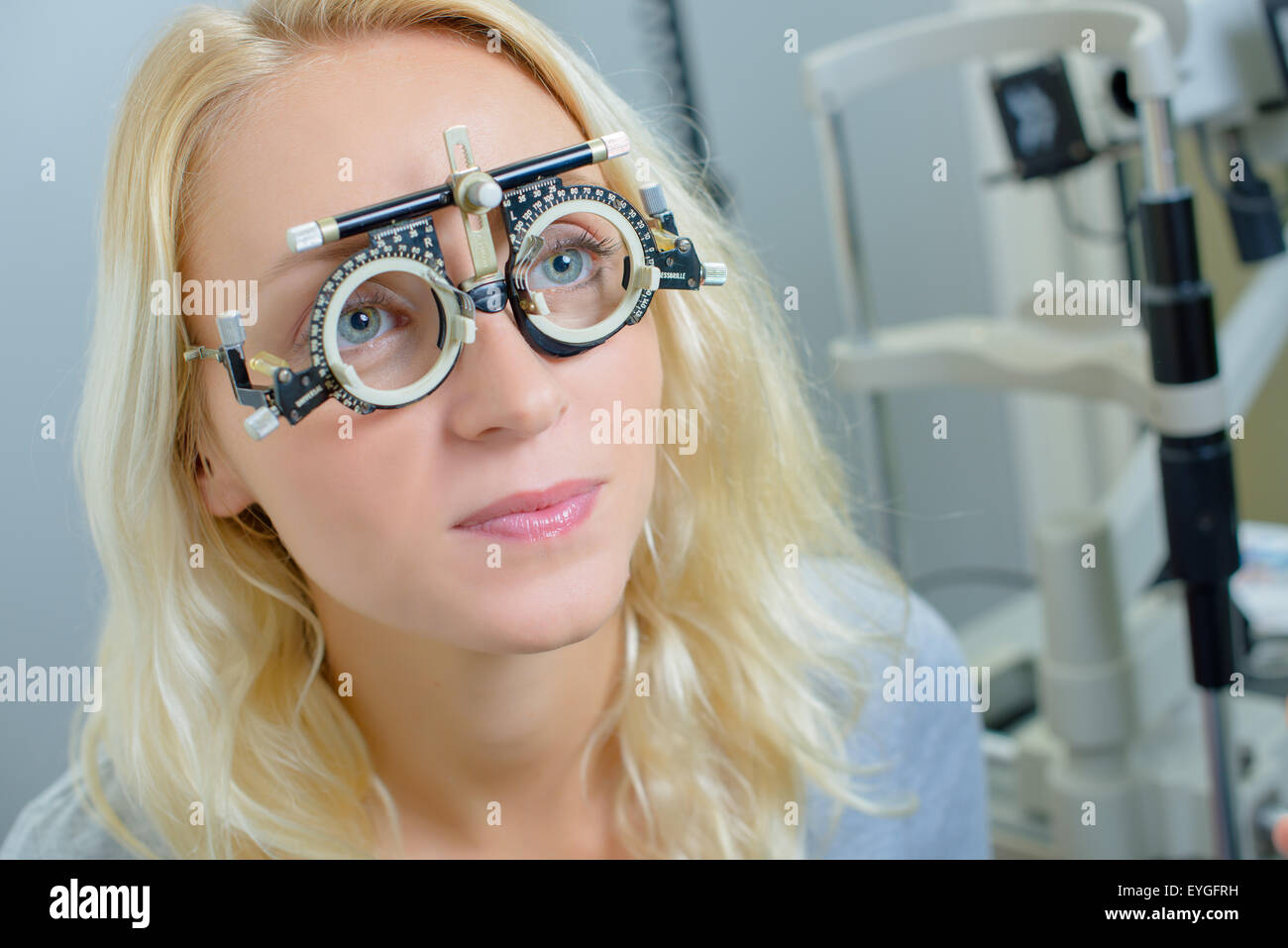 Lady wearing opticians testing glasses Stock Photo