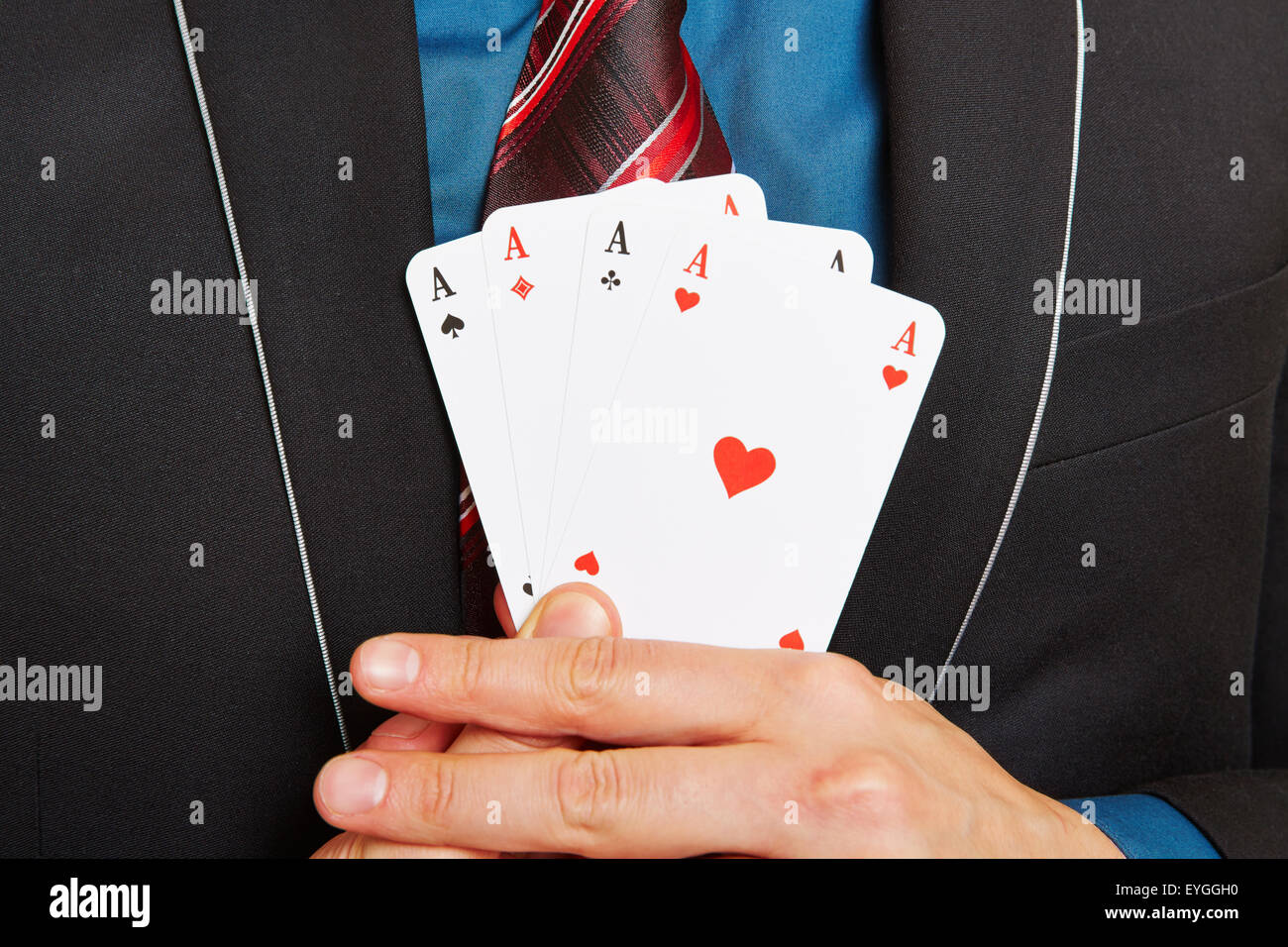 Business man holding four aces cards in his hands Stock Photo