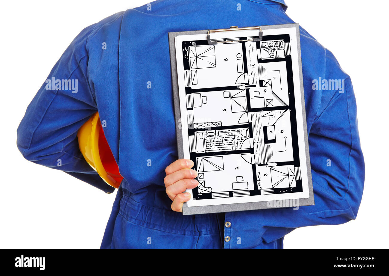 Worker holding floor plan of house on a clipboard behind his back Stock Photo