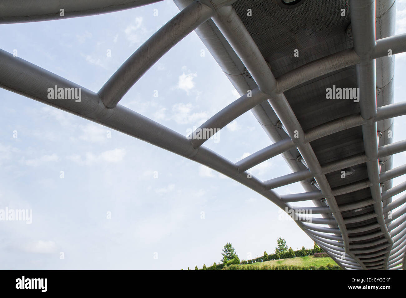 modern footbridge suspended photographed in perspective from below