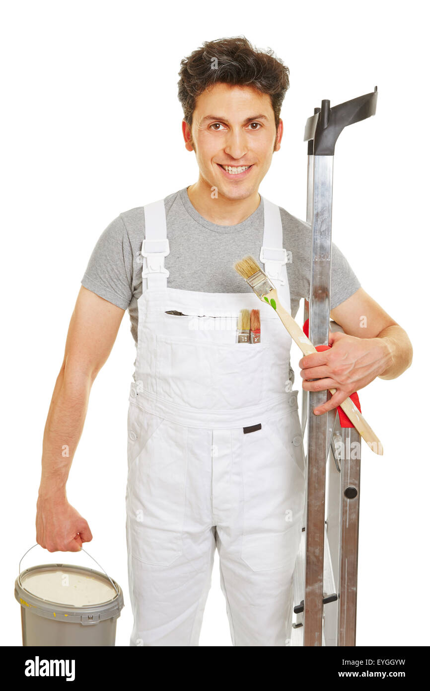 Painter at work with ladder and paint bucket and a brush Stock Photo