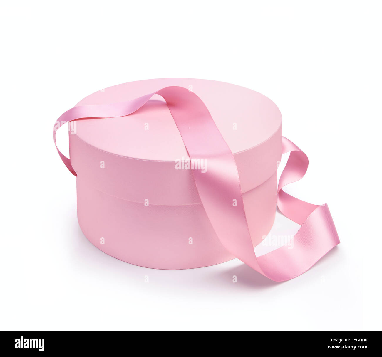 Gift round shape box in pink color with handle tape. Isolated on white background Stock Photo