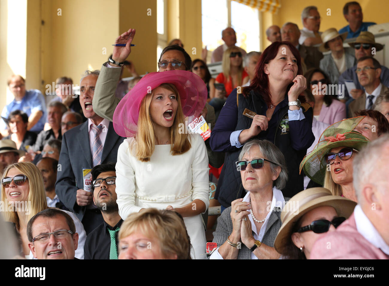 Iffezheim, Germany, people cheer when horse racing with Stock Photo