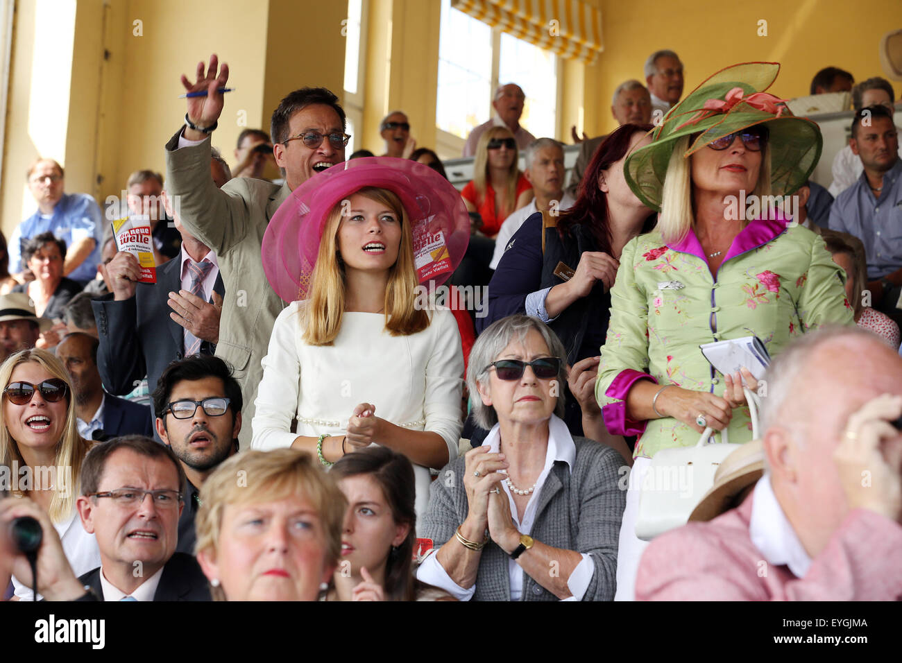 Iffezheim, Germany, people cheer when horse racing with Stock Photo