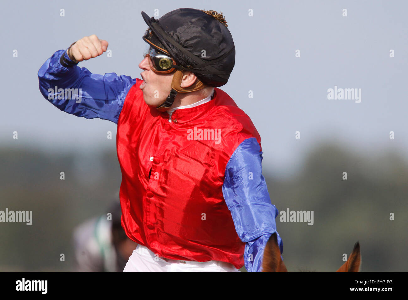 Iffezheim, Germany, Jockey Filip Minarik cheers after winning the Longines - Grosser Preis von Baden Stock Photo