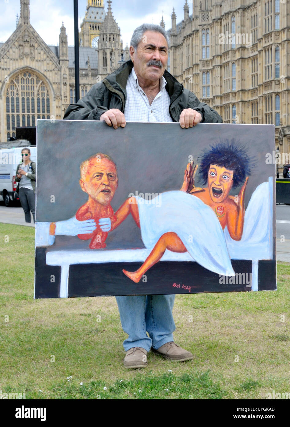 Westminster, London, UK. 29th July, 2015. Political cartoonist Kaya Mar unveils his latest work - featuring a rather surprised Labour Party giving birth to Jeremy Corbyn - outside Parliament Credit:  PjrNews/Alamy Live News Stock Photo