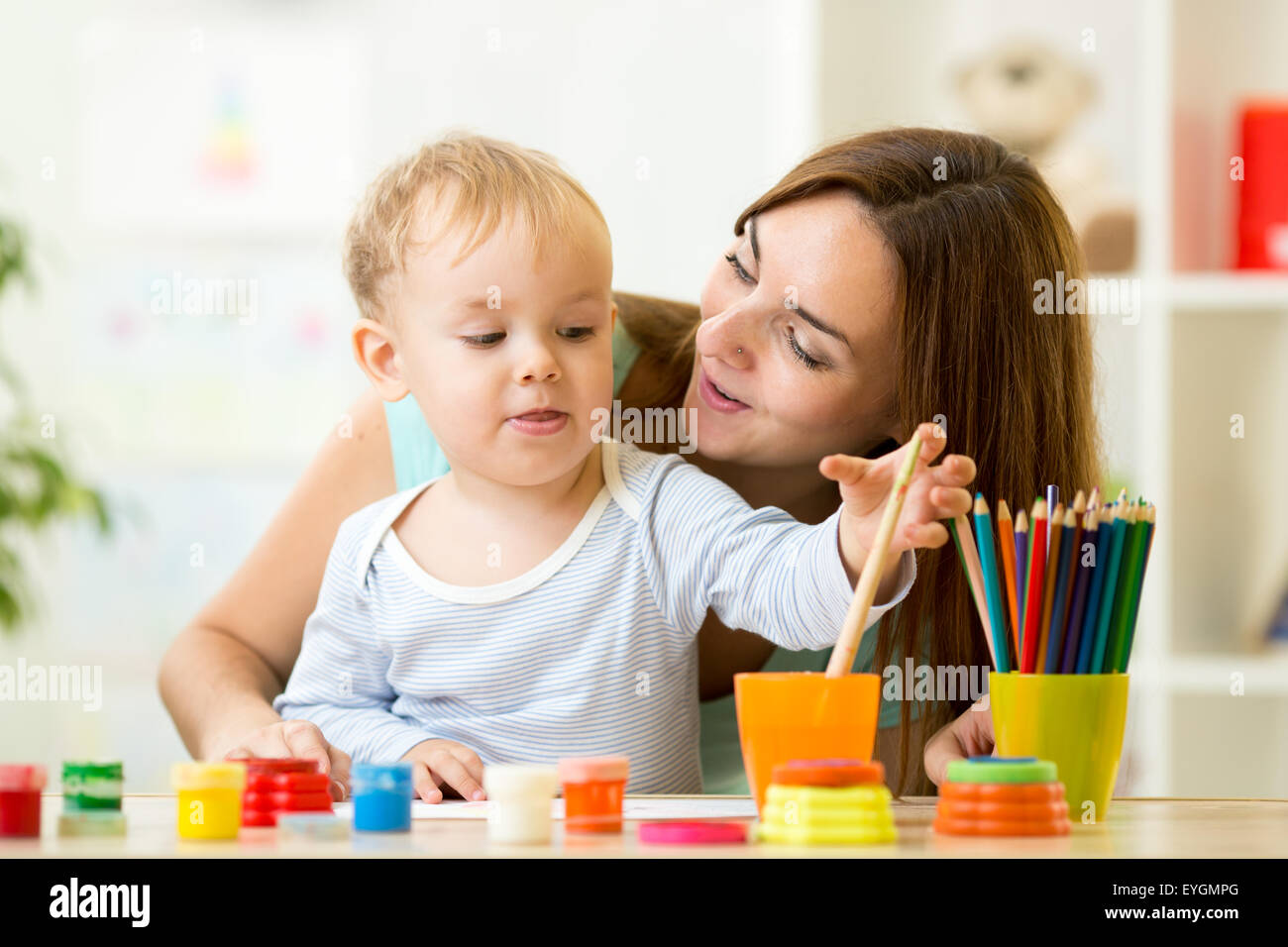 kid painting at home or day care center Stock Photo