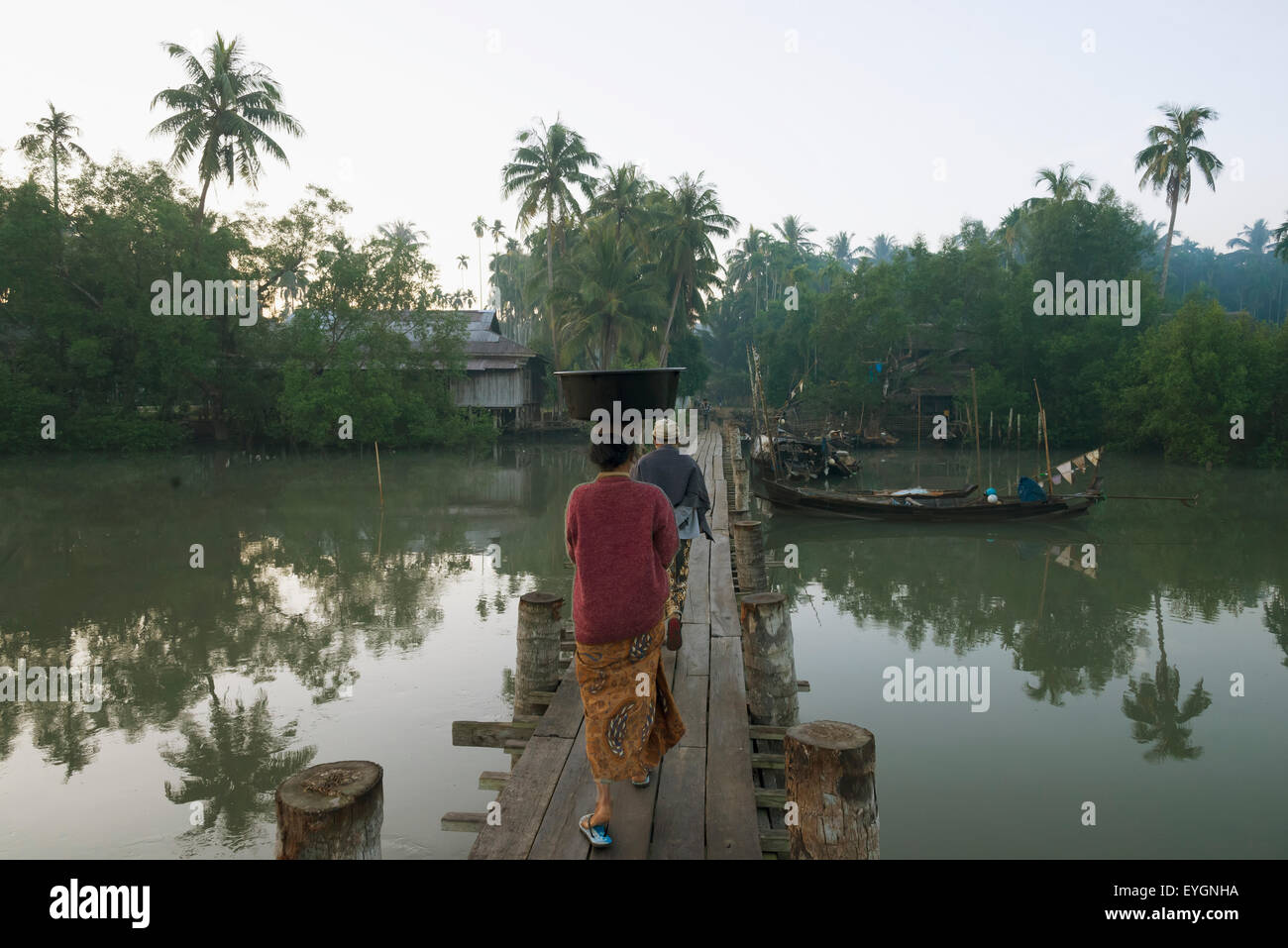 2 two people crossing wooden bridge hi-res stock photography and images ...