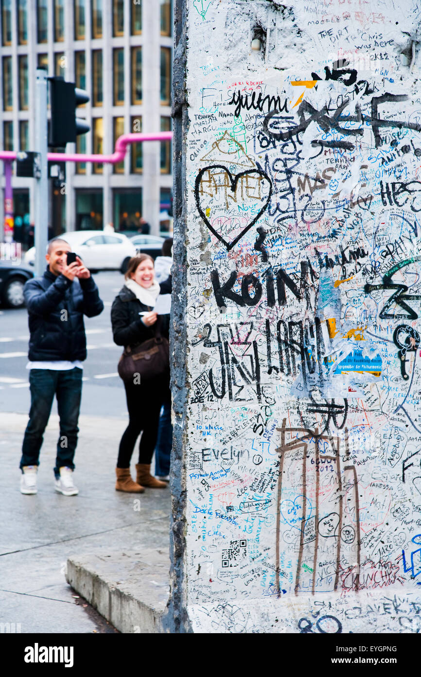 Germany, Berlin, Iron Curtain; Potsdamer Platz, Tourists watching