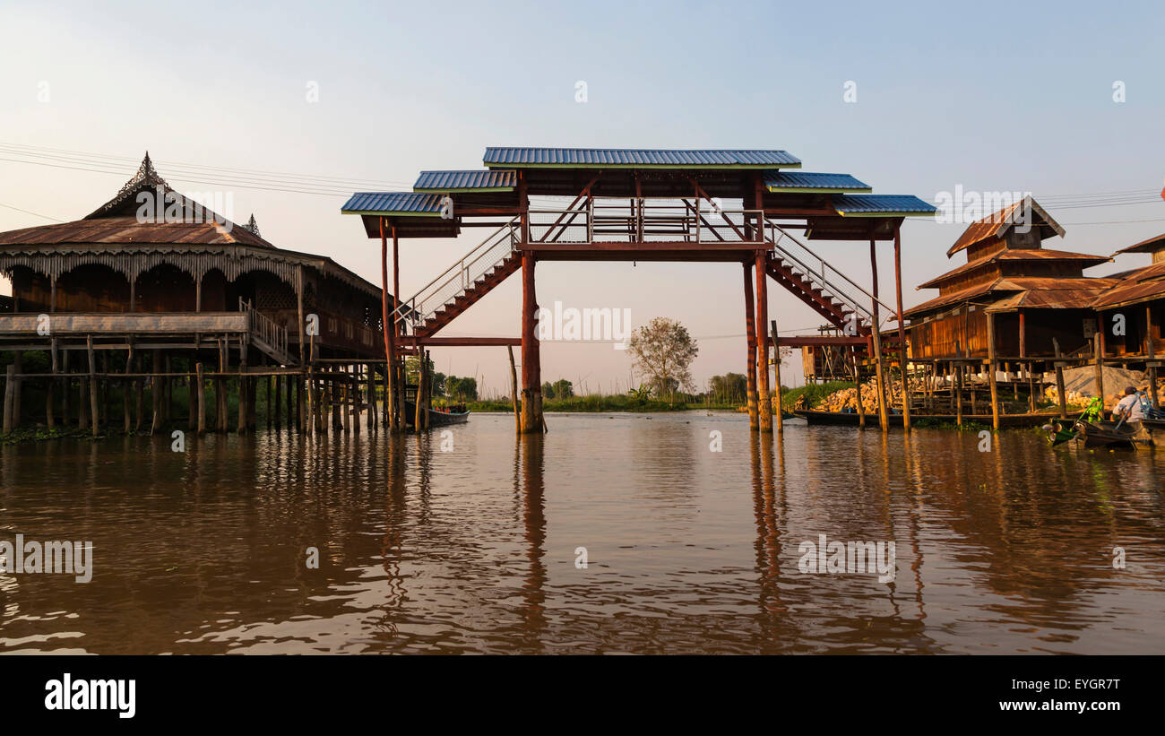 Bridge over the canal in a fishing village on stilts in Burma Stock Photo