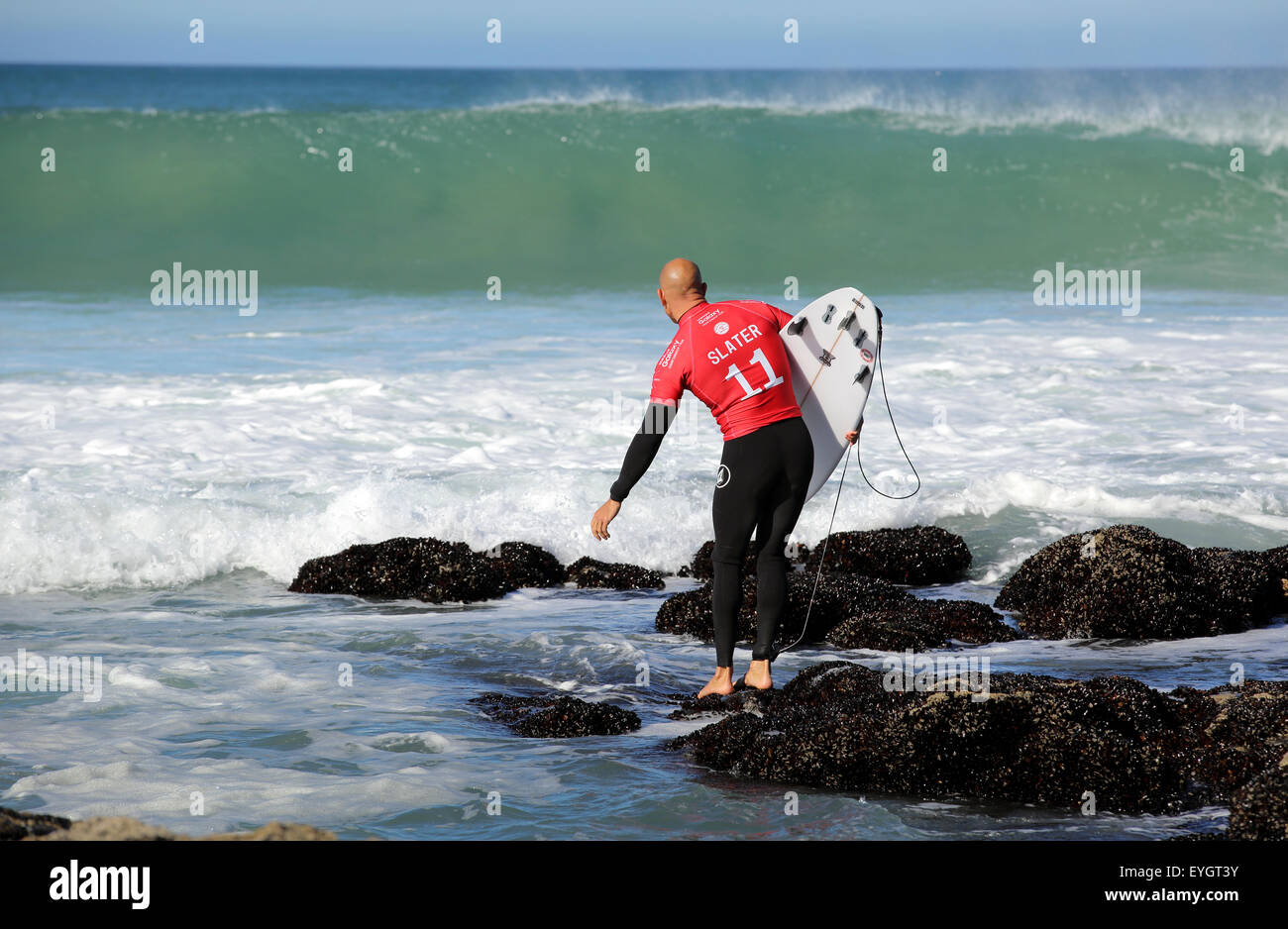 American professional surfer Kelly Slater entering the water for his semi-final at the 2015 J-Bay Open, South Africa Stock Photo