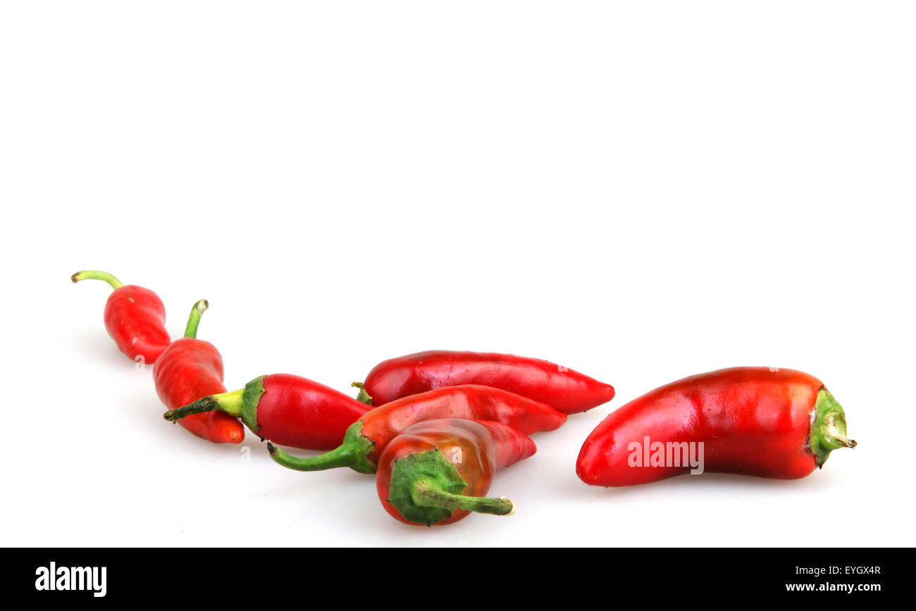 Red chilli peppers on white background Stock Photo - Alamy