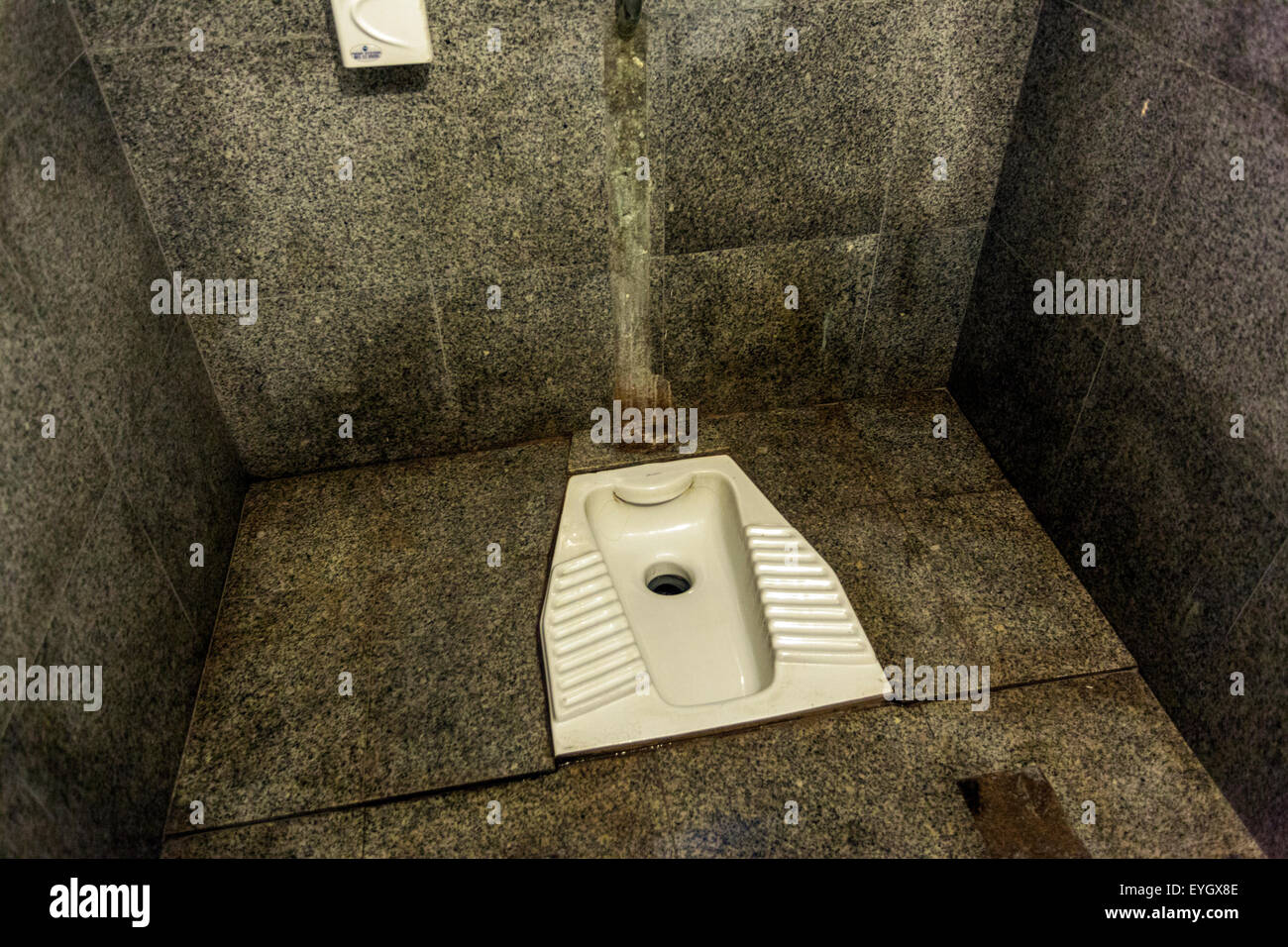 Public squat French or Turkish toilet at the bus station, never more, Thira Santorini, Cyclades Greece Stock Photo