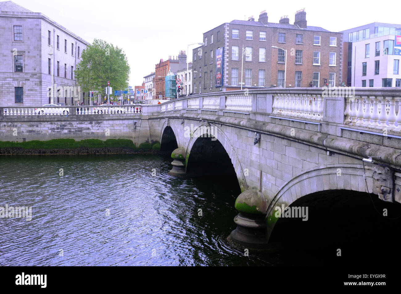 A stone bridge crossing the River Liffey in Dublin Stock Photo - Alamy