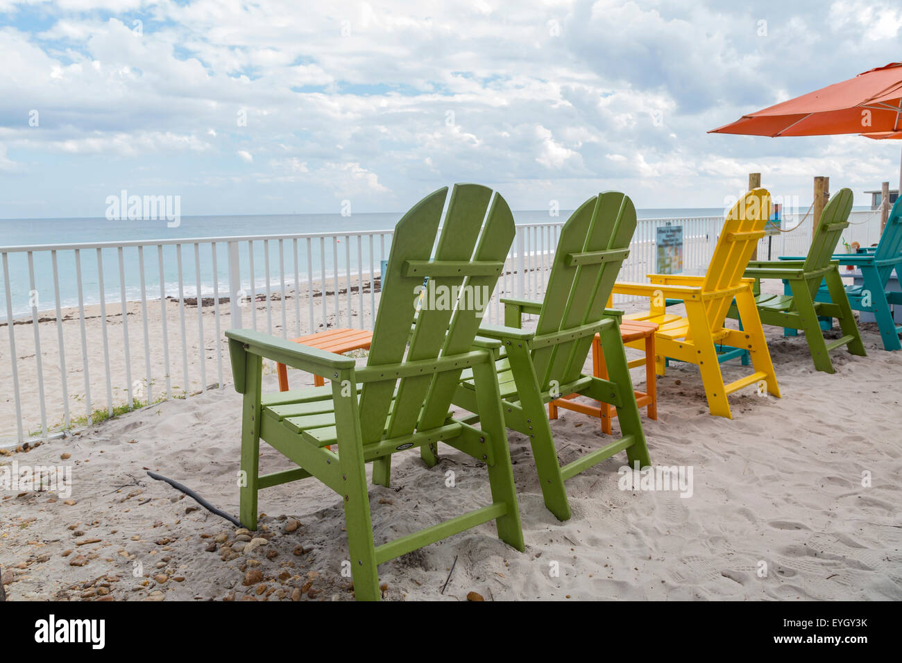 Green beach chairs and blue summer beach house, Florida Stock Photo Alamy