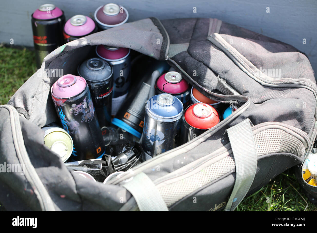 Used cans of spray paint in a bag Stock Photo - Alamy