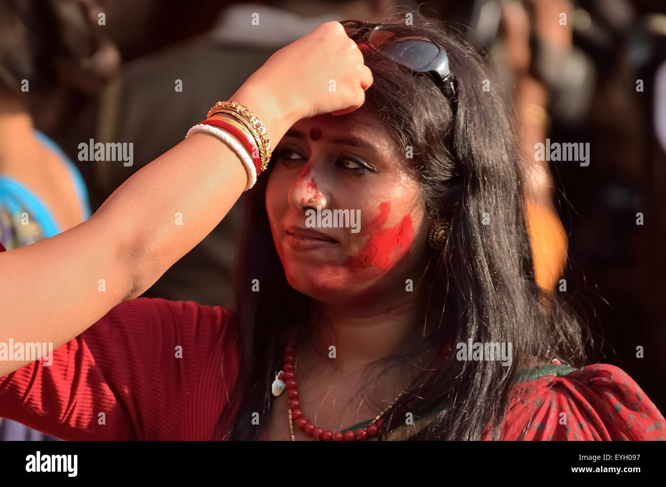 Bengali married women participate in a festival called "Sindur Khela" smearing of the vermilion on Durga Puja's last day. Stock Photo