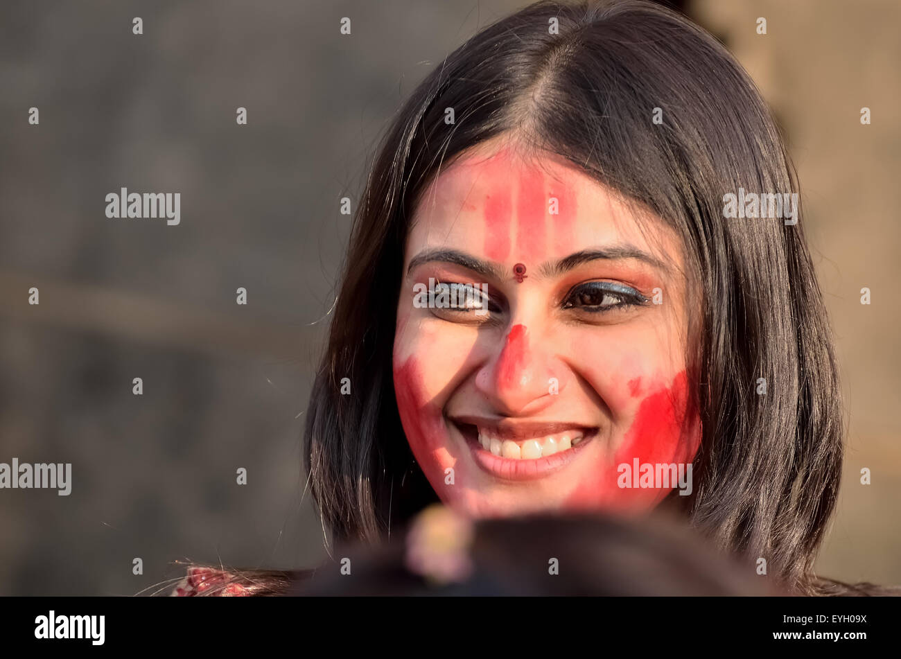 Bengali unmarried women participate in a festival called "Sindur Khela" smearing of the vermilion on Durga Puja's last day. Stock Photo