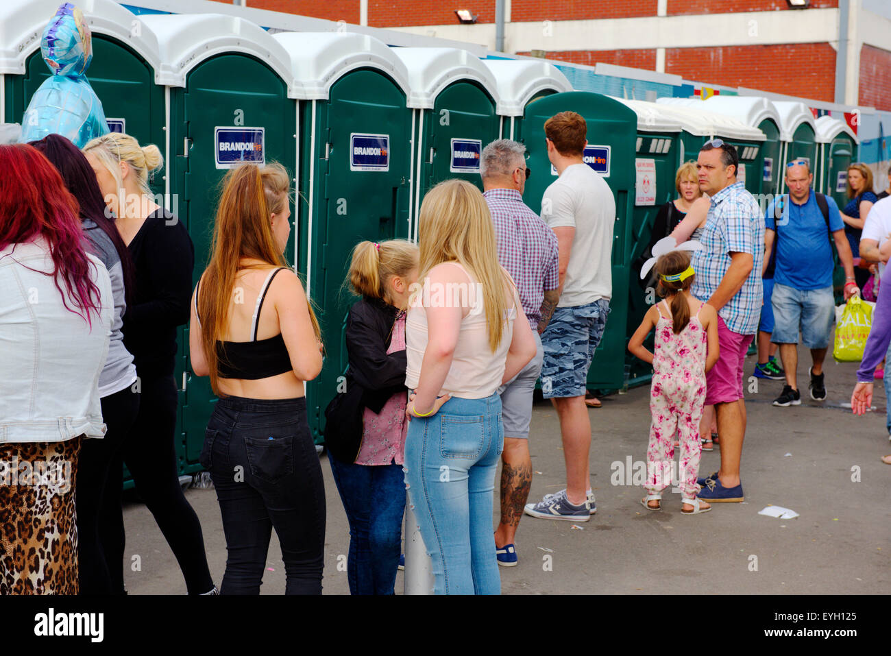 Queue at toilets during festival Stock Photo - Alamy