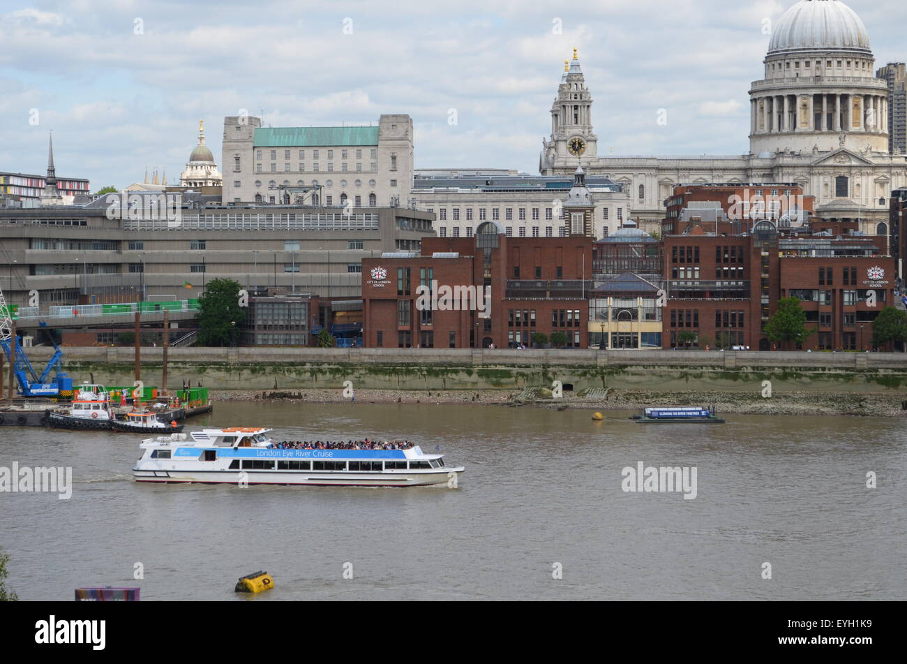 river thames, with london landscape in backround with tour boat Stock Photo