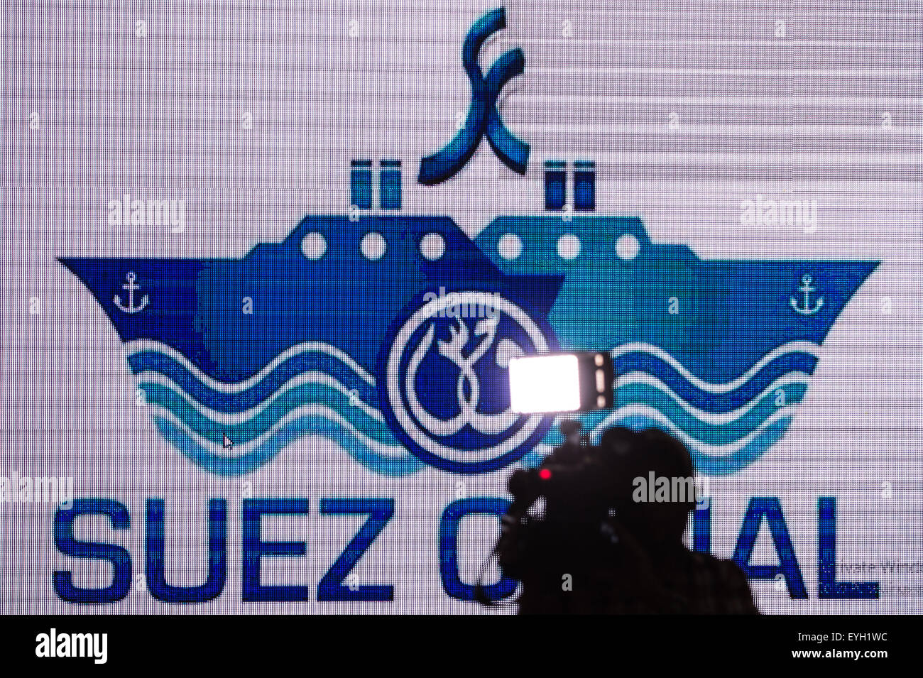 Ismailia, Egypt. 29th July, 2015. A cameraman takes video clips on a press conference about the new Suez Canal in Ismailia, a port city in Egypt, on July 29, 2015. The dredging work of Egypt's 'New Suez Canal' has been completed and the waterway is ready as well as safe for huge ship navigation, Mohab Memish, head of the Suez Canal Authority (SCA), told reporters in a press conference Wednesday. © Pan Chaoyue/Xinhua/Alamy Live News Stock Photo