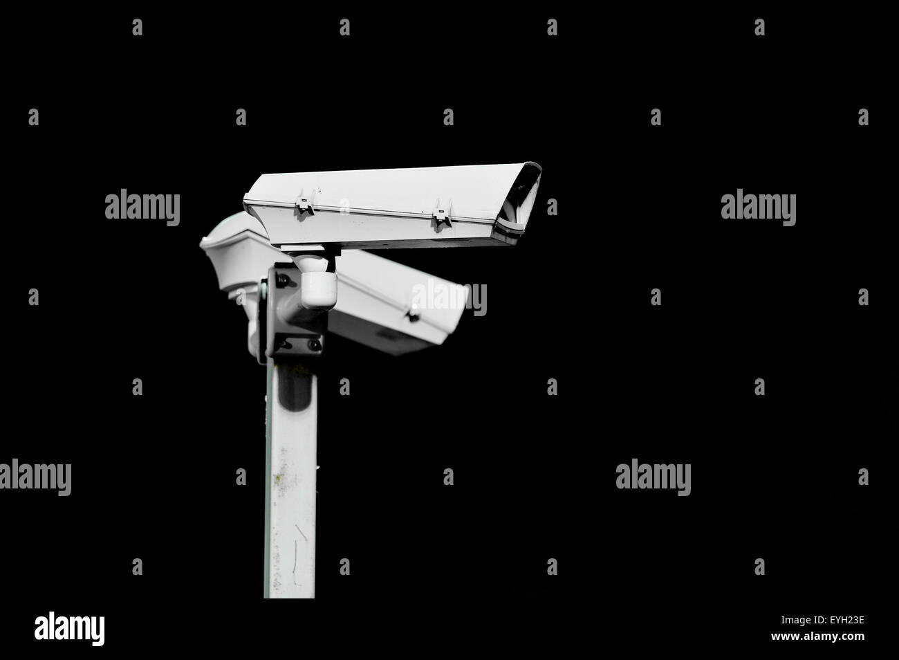 Two surveillance cameras isolated on black background Stock Photo Alamy