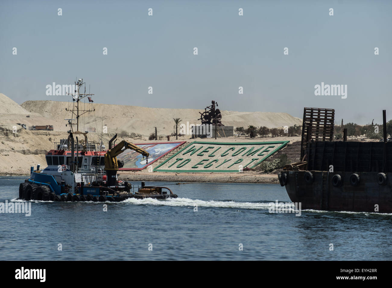 Ismailia, Egypt. 29th July, 2015. Boats cross through the new Suez Canal in Ismailia, a port city in Egypt, on July 29, 2015. The dredging work of Egypt's 'New Suez Canal' has been completed and the waterway is ready as well as safe for huge ship navigation, Mohab Memish, head of the Suez Canal Authority (SCA), told reporters in a press conference Wednesday. © Pan Chaoyue/Xinhua/Alamy Live News Stock Photo