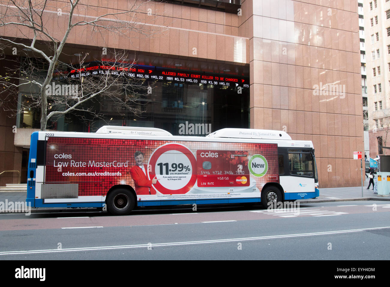 Sydney bus in elizabeth street in the central business district, bus is advertising Coles credit card,Sydney,Australia Stock Photo