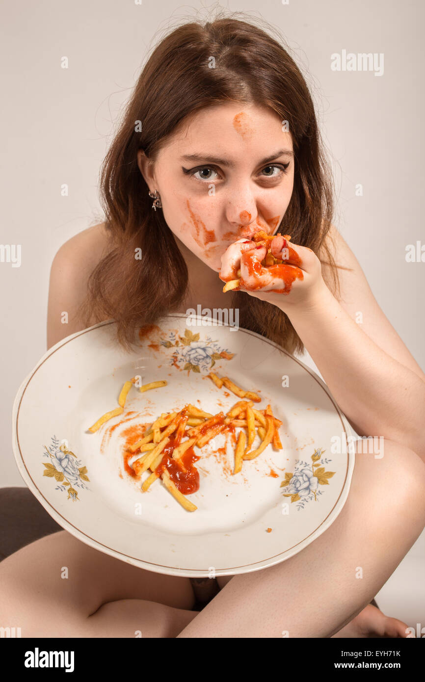 Fun Woman Eats French Fries Stock Photo
