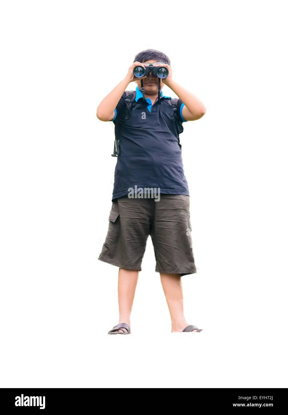 A young boy watching through binoculars with copy space and isolated on white showing hobby related scientific activity Stock Photo