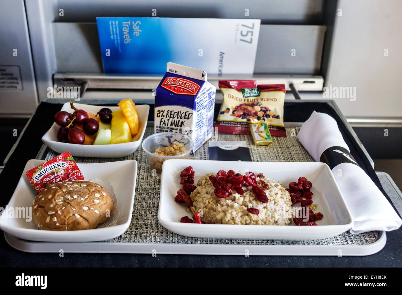 Miami Florida,International Airport,MIA,first class cabin,onboard,American Airlines,breakfast,tray,oatmeal,cranberries,FL150626034 Stock Photo