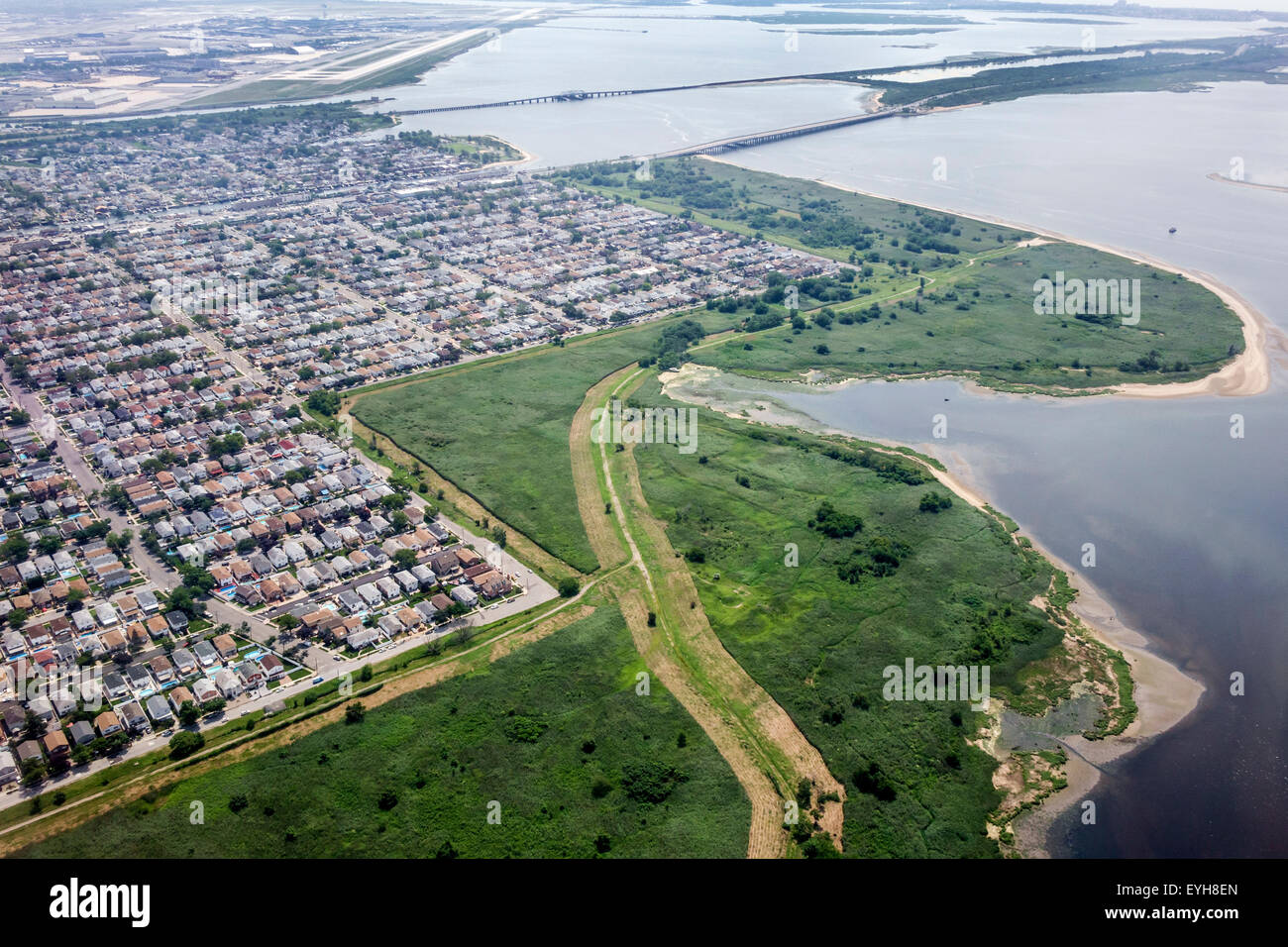 New York City,NY NYC,Queens,John F. Kennedy International Airport,JFK,aerial overhead view from above,approach,Jamaica Bay,Howard Beach,Spring Creek P Stock Photo