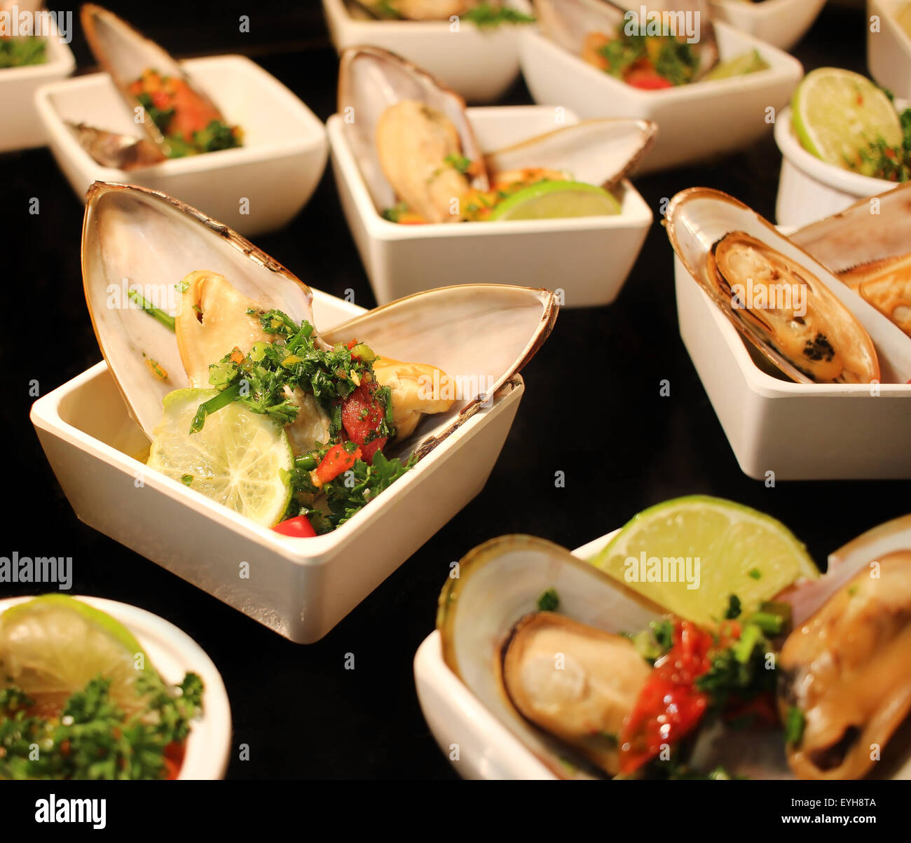Small seafood appetizers at the restaurant Stock Photo