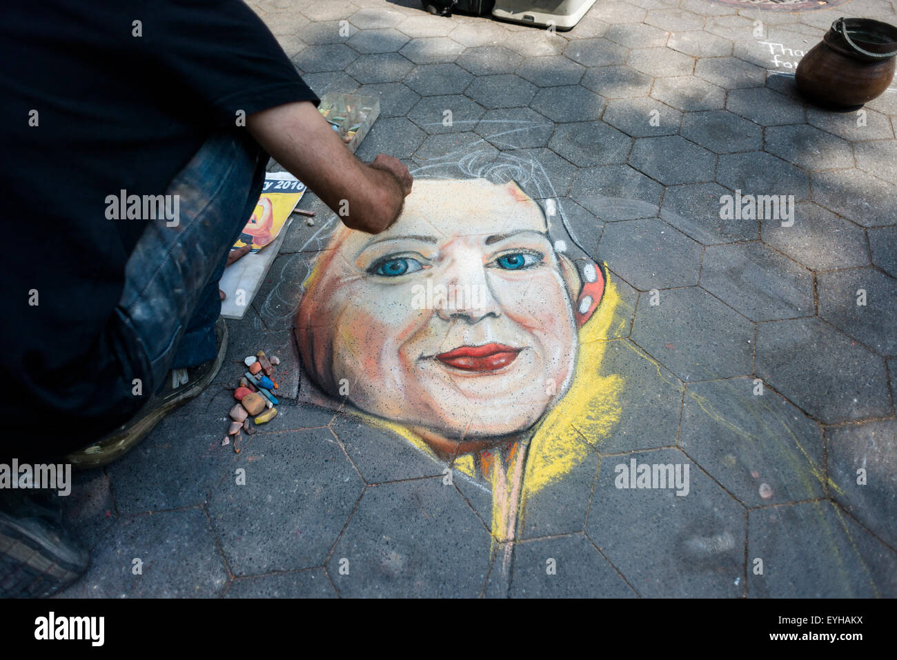 New York, NY 26 July 2015 Street artist draws a chalk portrait of