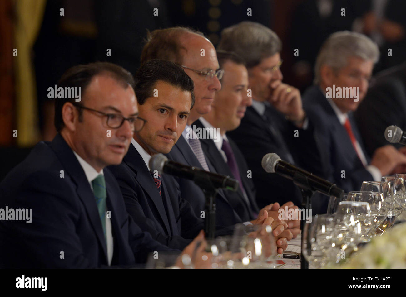 Mexico City, Mexico. 29th July, 2015. Image provided by Mexico's Presidency shows Mexican President Enrique Pena Nieto (2nd L) and Finance Minister Luis Videgaray (1st L) taking part in a dinner with members of the U.S. finance company BlackRock at the National Palace in Mexico City, capital of Mexico, on July 29, 2015. © Mexico's Presidency/Xinhua/Alamy Live News Stock Photo