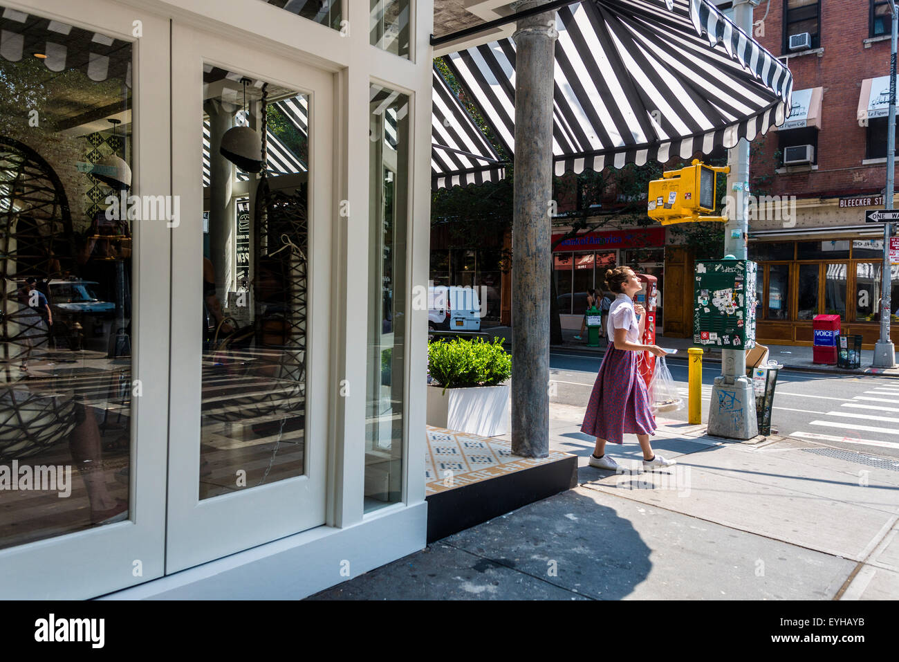 New York, NY Woman on the corner of Bleecker and MacDougal Streets in
