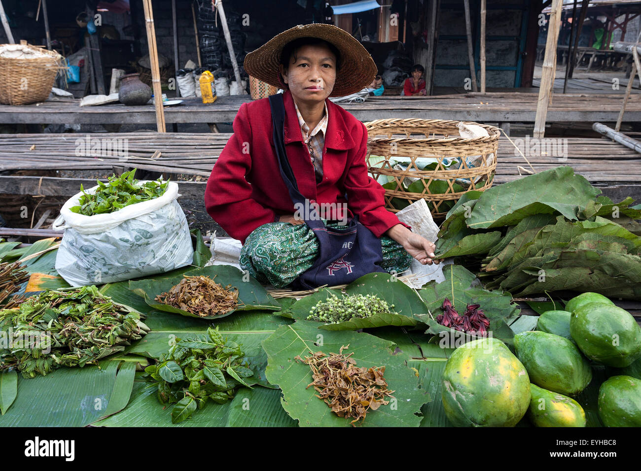 Local woman selling vegetables in the market in Nyaungshwe, Shan State, Myanmar Stock Photo