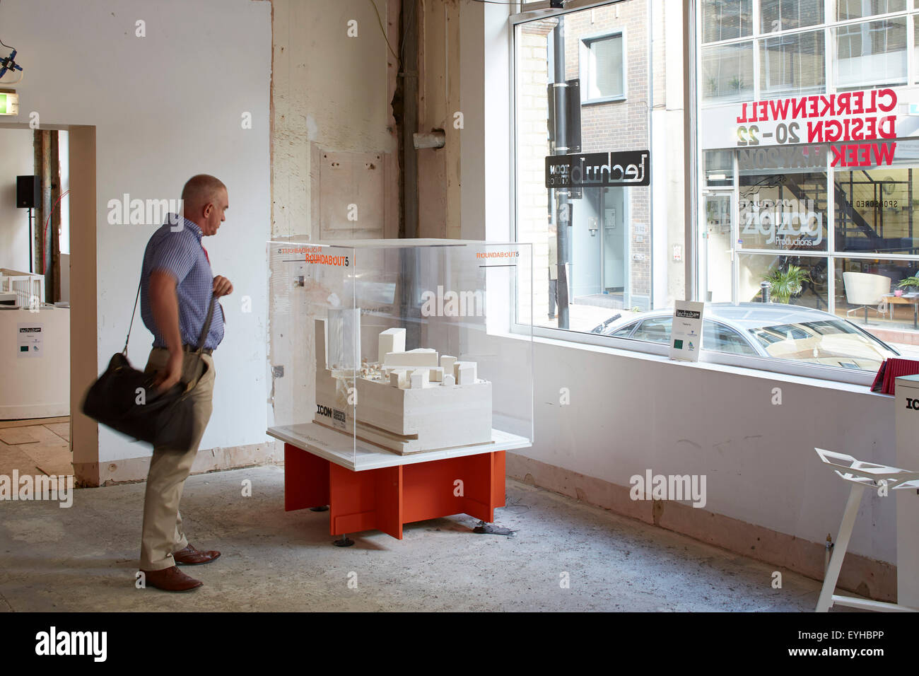 Figure looking at Architectural model during Clerkenwell design week. Commerical stock portfolio (continued), na, United Kingdom. Architect: na, 2015. Stock Photo