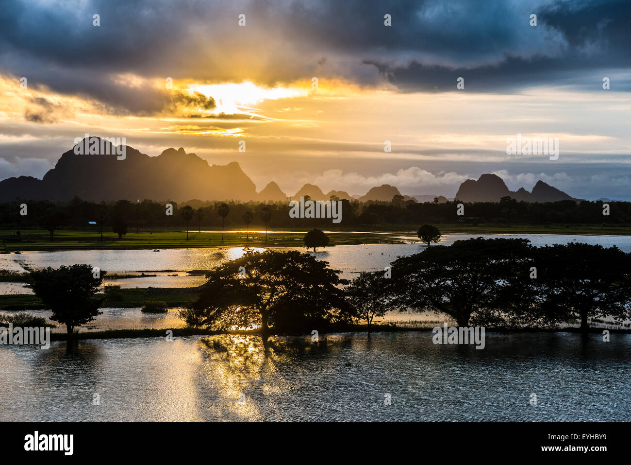 Sunset above tower karst mountains, artificial lake, landscape in the evening light, Hpa-an, Karen or Kayin State, Myanmar Stock Photo
