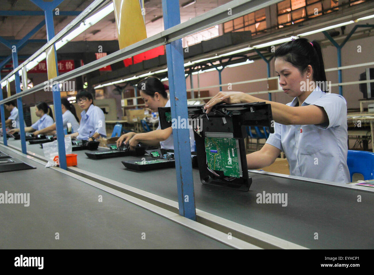 (150730) -- HO CHI MINH CITY, July 30, 2015 (Xinhua) -- File Photo taken on July 10, 2015 shows people work at the TCL Company Factory in Dong Nai province, Vietnam. To gain big market shares in the global market and the Vietnamese market in particular, Chinese electronics giant TCL has focused on all-round localization strategies to tap deeply into Vietnam's economy for joint development. Right after setting foot on Vietnamese soil in 1999, TCL set targets of developing its own brands, distribution networks and technologies. Now, TCL Vietnam has over 200 authorized dealers and distribution ne Stock Photo