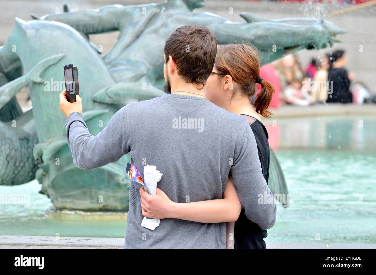 London, England, UK. Young  couple in Trafalgar Square taking a selfie Stock Photo