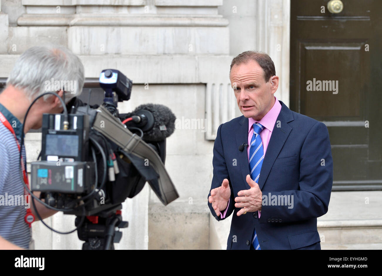 Norman Smith, BBC News Chief Political Correspondent, broadcasting live outside the Cabinet Office in Whitehall