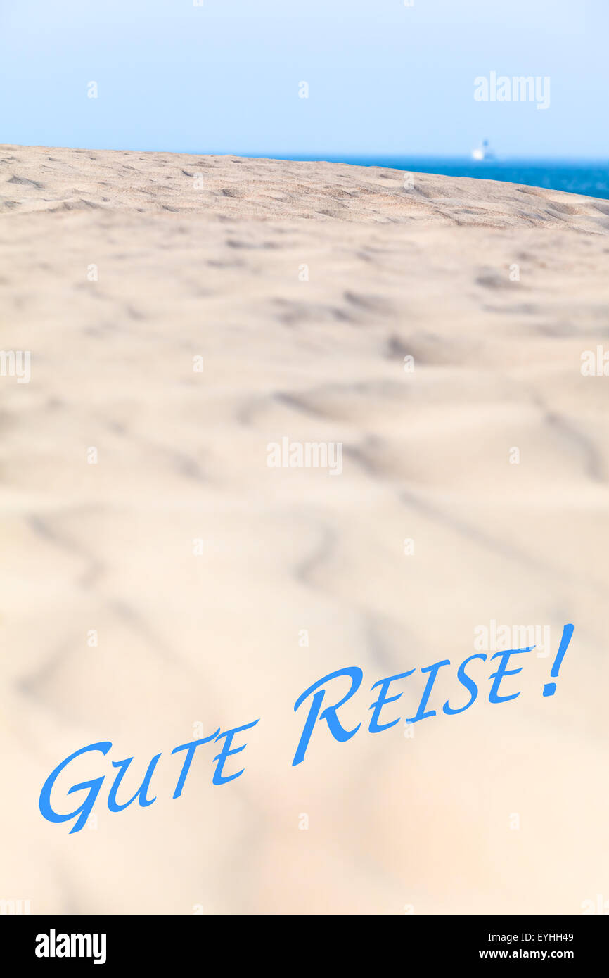 Large sand dune and far away ship at the blue ocean background. Message