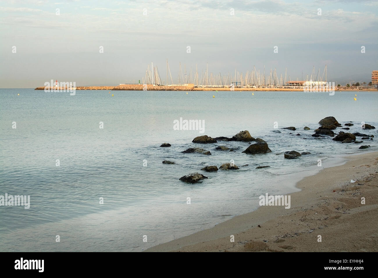 Majorca Rays First sun rays hitting the buildings at dawn in Playa de Palma near Can ...
