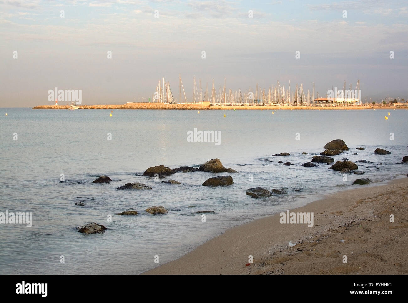 First sun rays hitting the masts in the marina at the break of dawn in Playa de Palma near Can Pastilla, Mallorca Stock Photo
