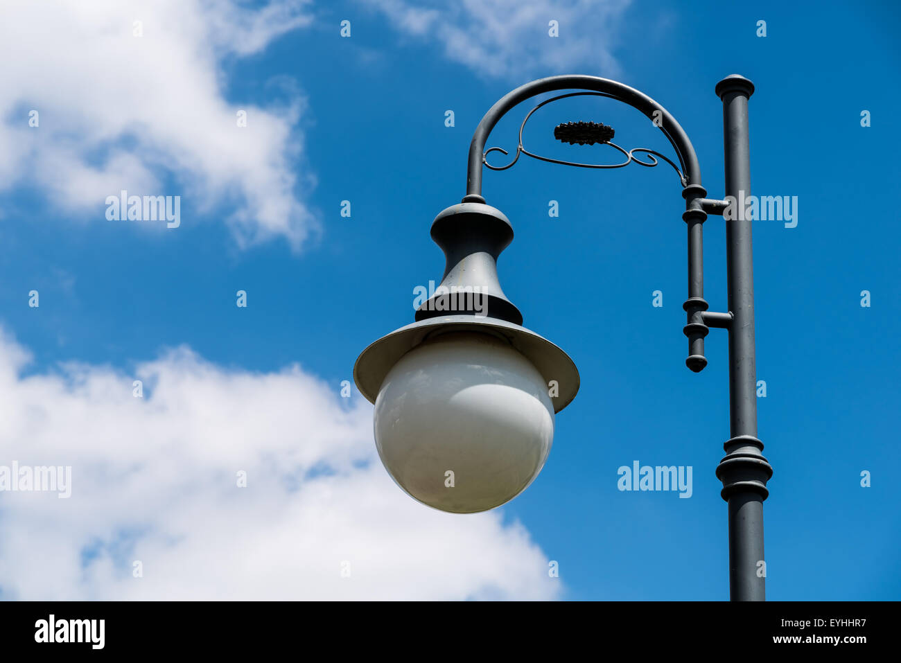 Vintage Street Light Pole Against Blue Sky Stock Photo - Alamy