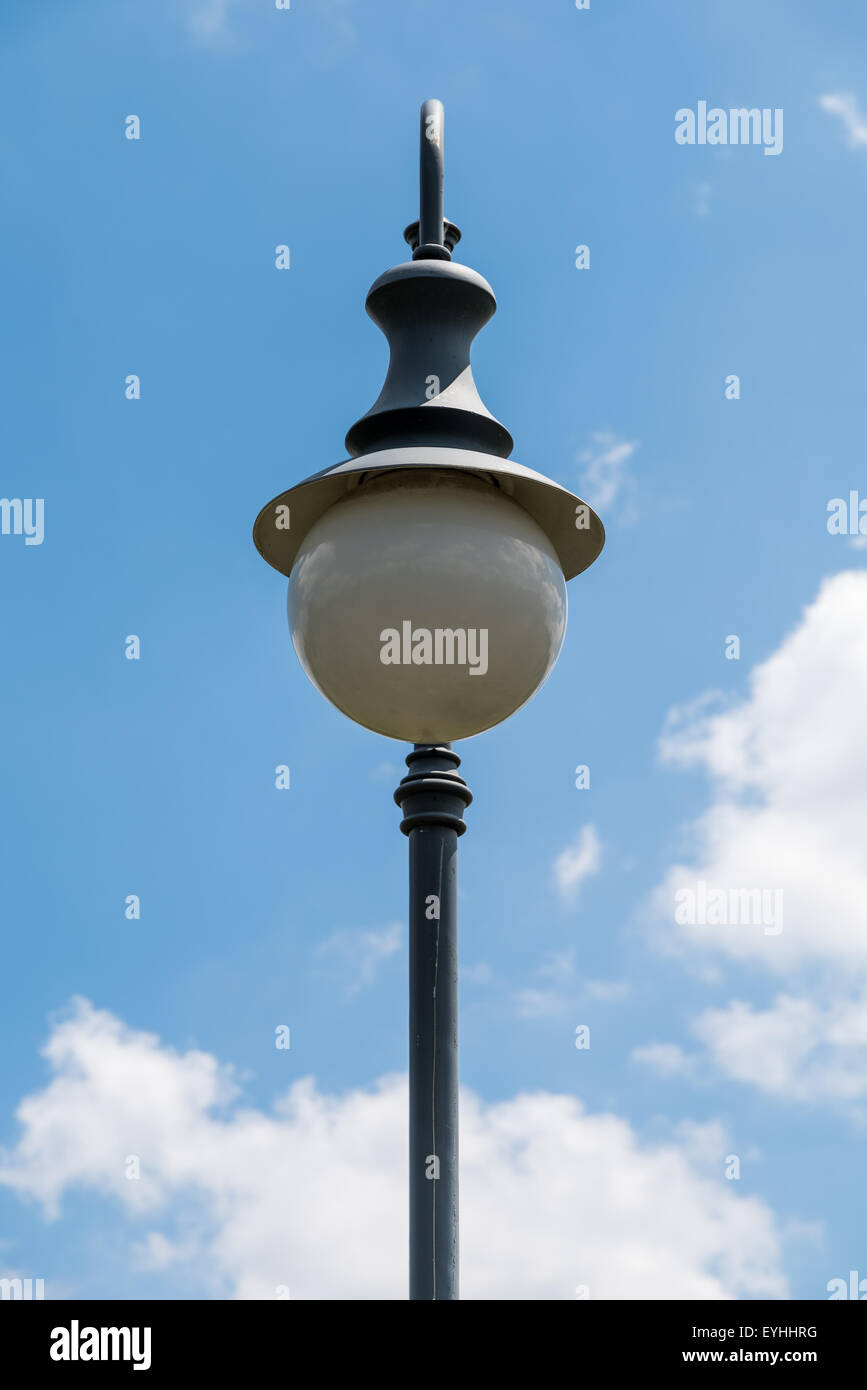 Vintage Street Light Pole Against Blue Sky Stock Photo