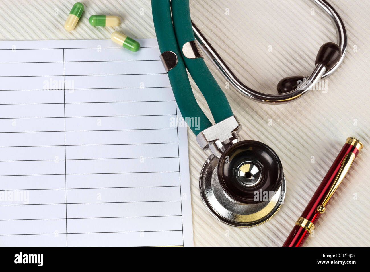 A doctors stethoscope and notepad - Space for Text Stock Photo