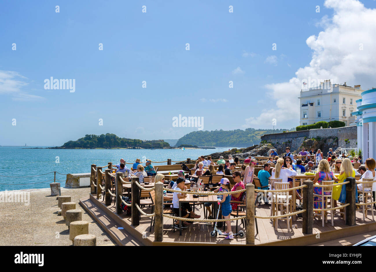 The Waterfront bar and restaurant with Drake Island in the background, Grand Parade, Plymouth, Devon, England, UK Stock Photo