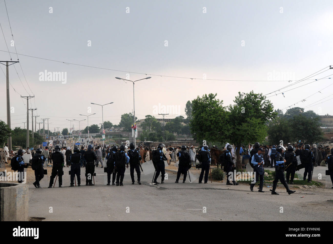Islamabad, Pakistan. 30th July, 2015. Pakistani riot police stand guard ...